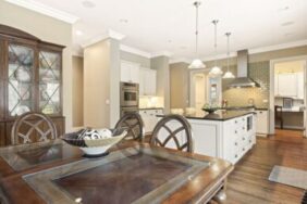 a kitchen with a table and a large island