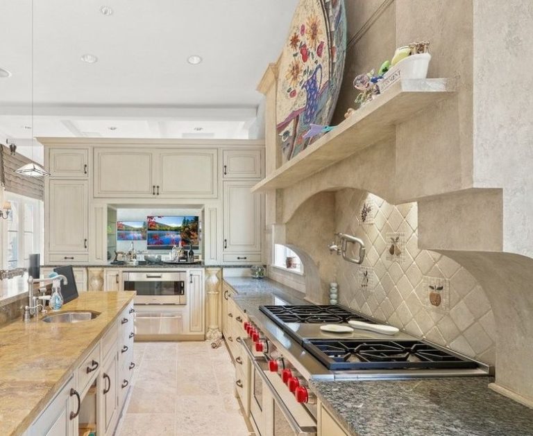 a kitchen with a large plate on the wall